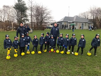 Castlevale 2016s coaches and players with their new kit and footballs